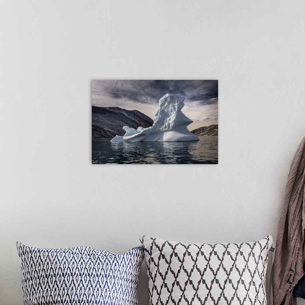 A bohemian room featuring Iceberg floating in Greenland's Kong Oscar fjord, Greenland.