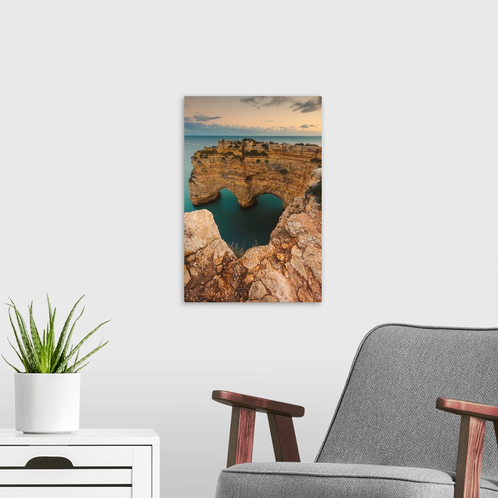 A modern room featuring Iconic rock formation, Arcos Naturais, Heart of the Algarve, and the turquoise water of the Atlan...