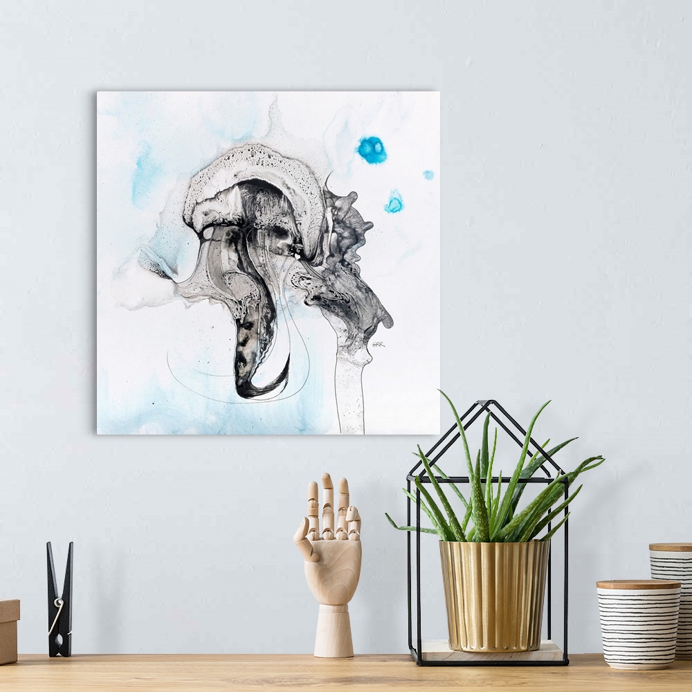A bohemian room featuring Illustration of a black and white abstract with subtle human faces on a mottled blue and white ba...