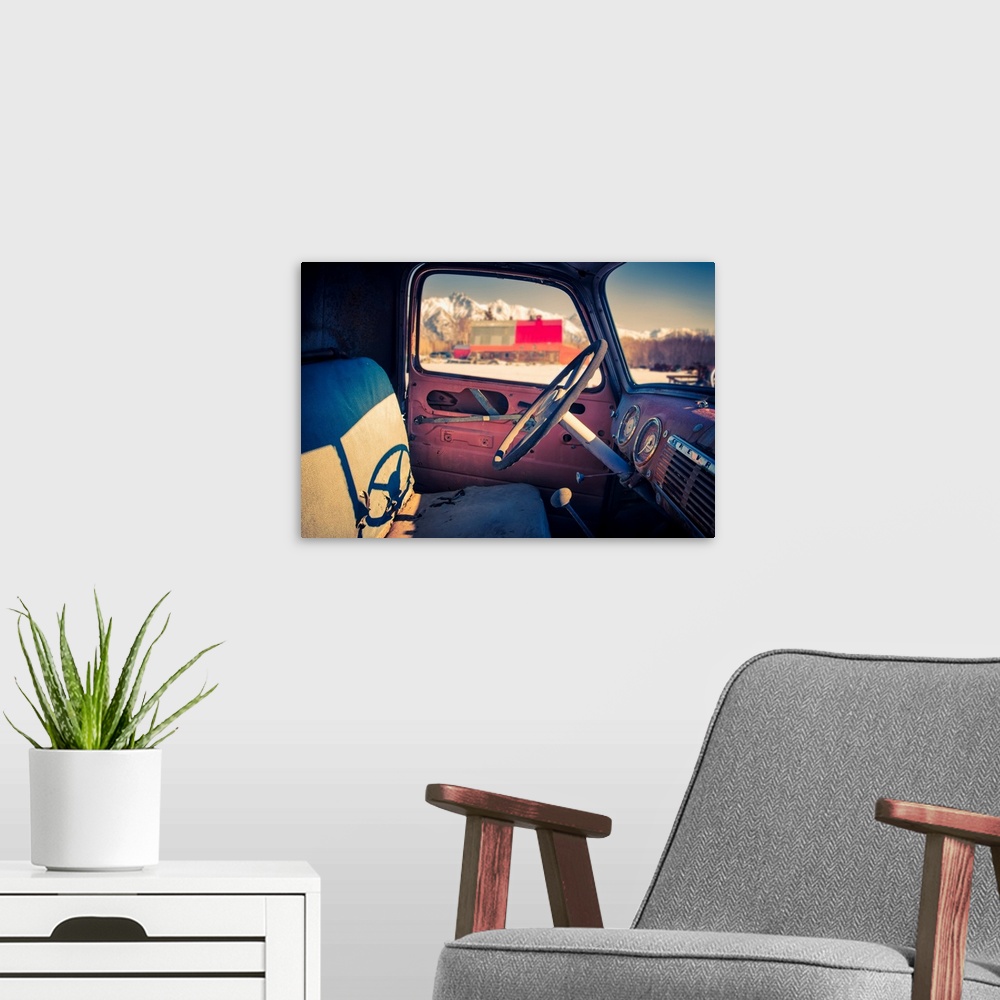A modern room featuring Interior view of a old, worn truck with Pioneer Peak visible out of the automobile window, South-...