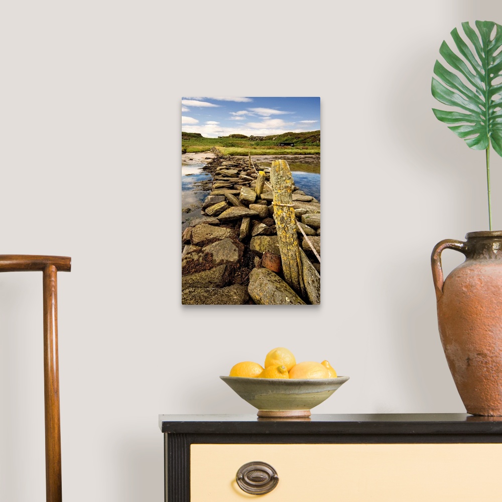A traditional room featuring Isle Of Gigha, Scotland. Rocky Shoreline And Wharf.