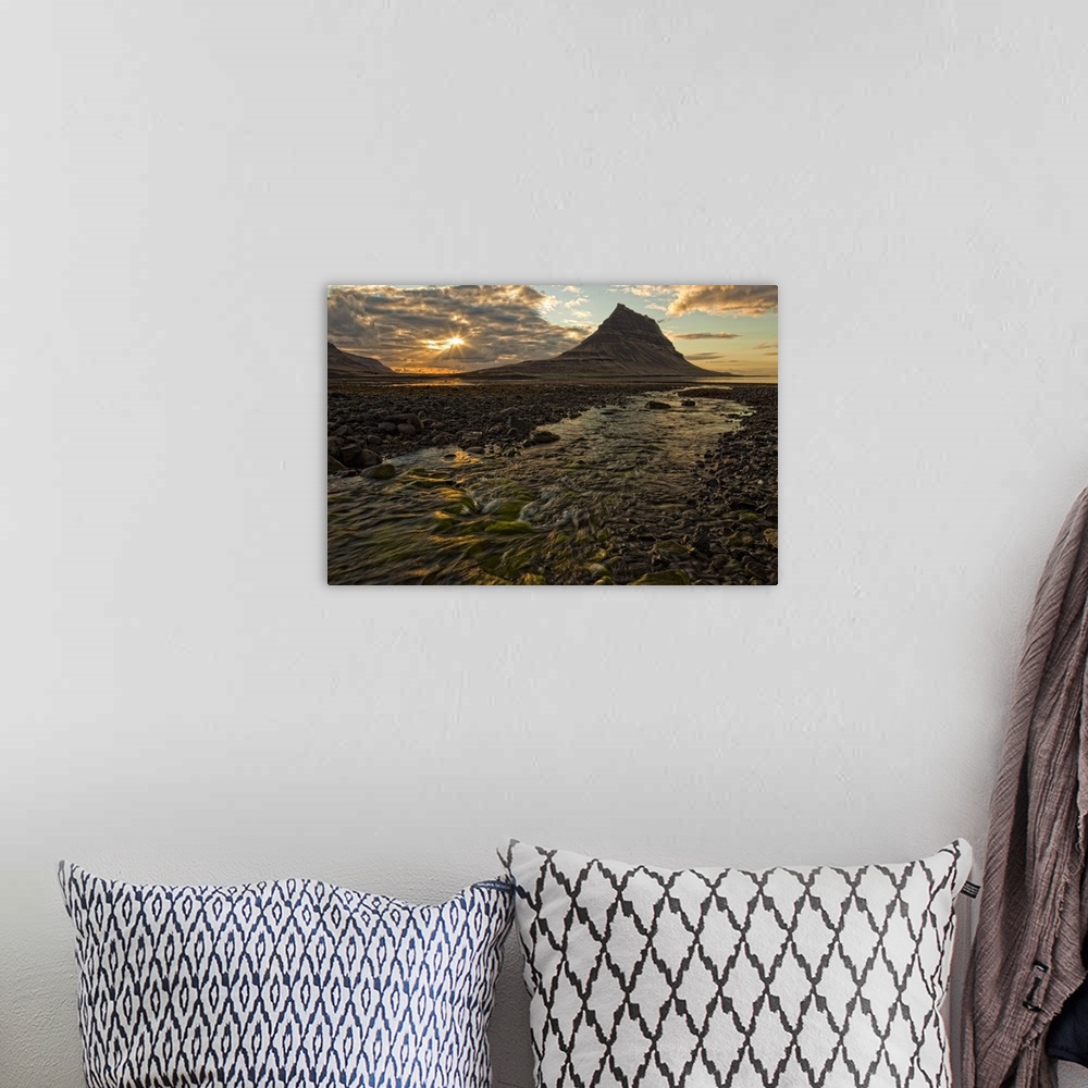 A bohemian room featuring Kirkjufell Mountain above the ocean at sunset on the Snaefellsnes peninsula, Iceland