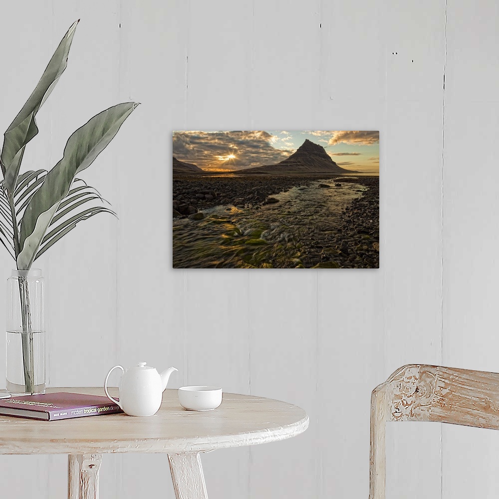 A farmhouse room featuring Kirkjufell Mountain above the ocean at sunset on the Snaefellsnes peninsula, Iceland