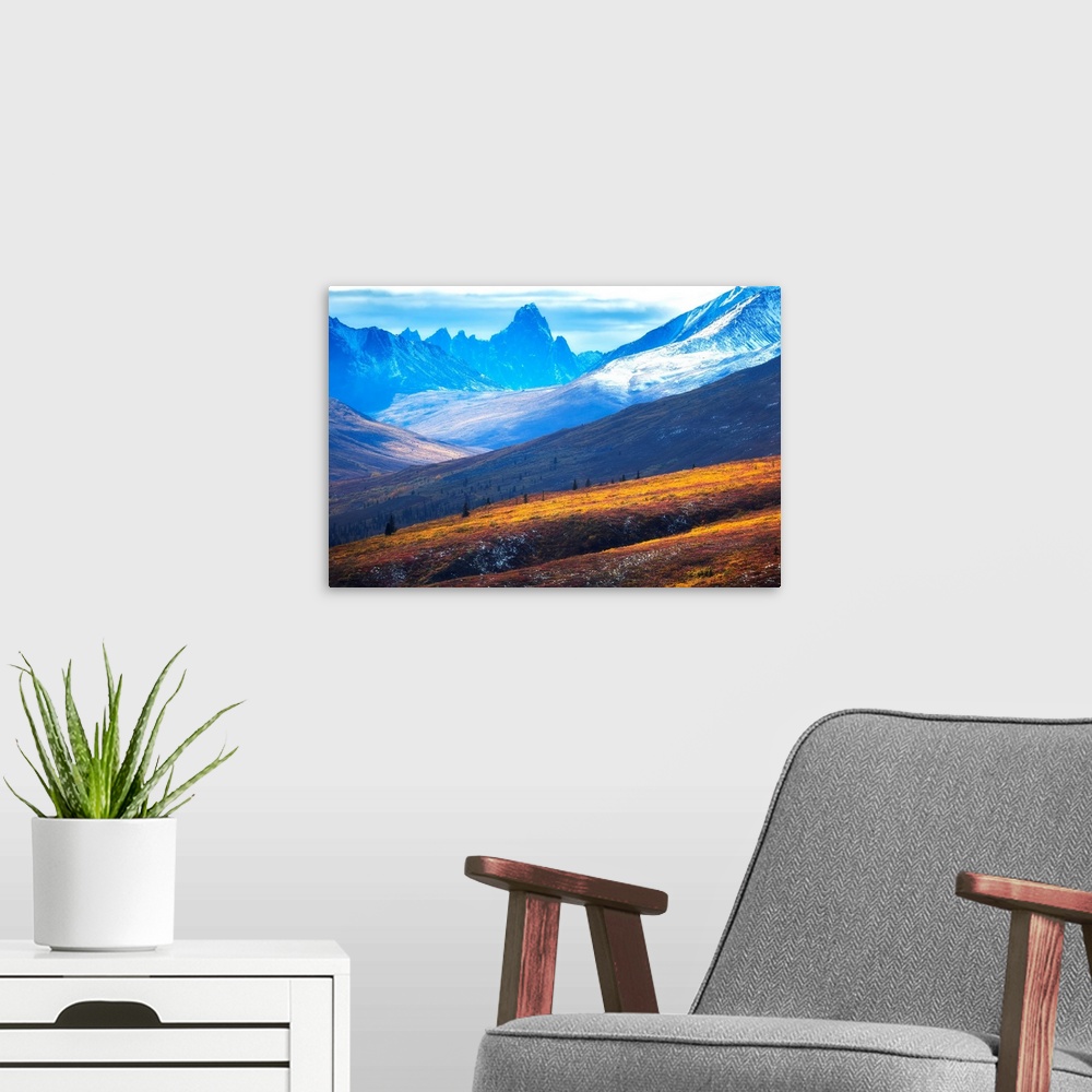 A modern room featuring The north Klondike valley lights up along the Dempster Highway with Tombstone mountain in the dis...