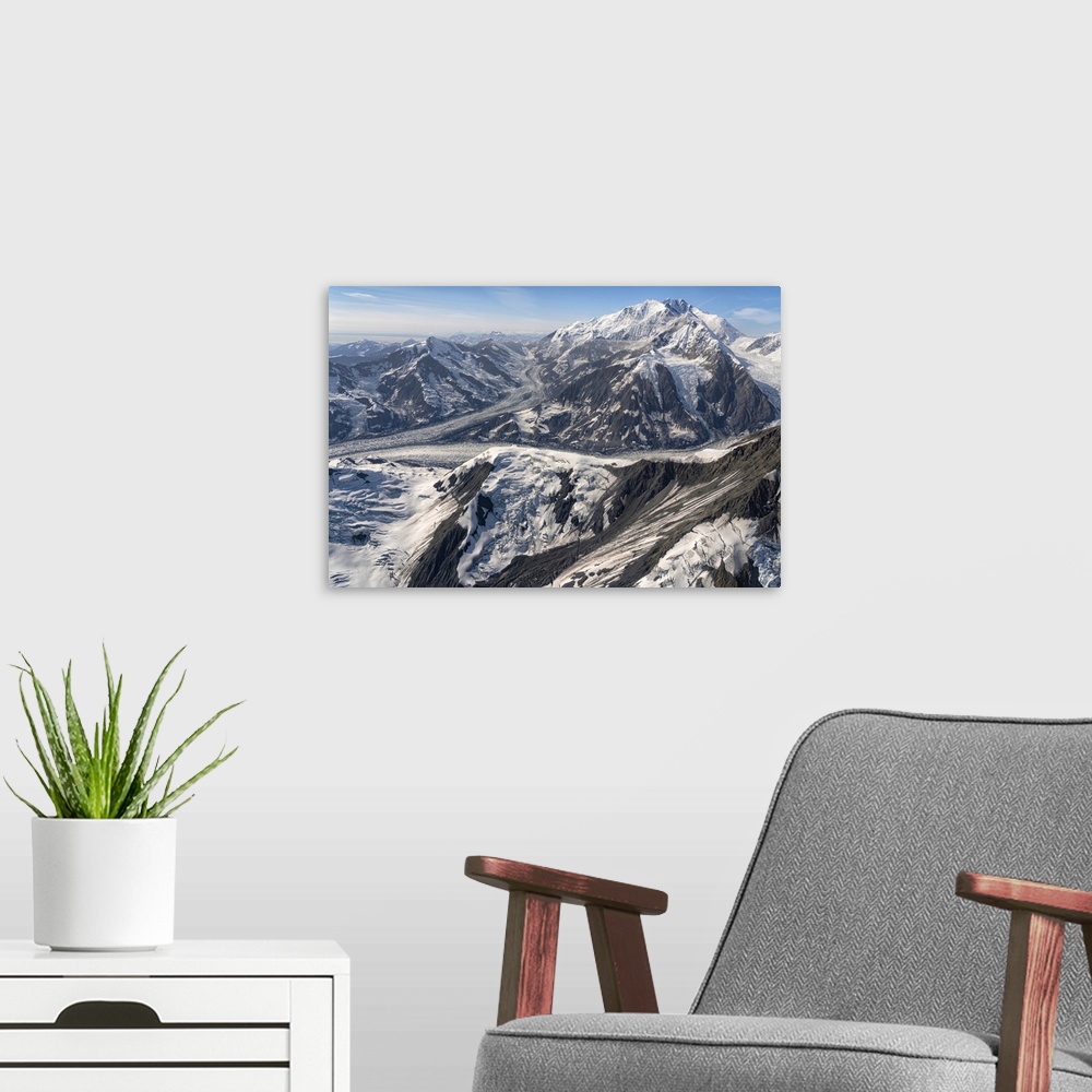 A modern room featuring Aerial photo of Kluane national park, with snow covered mountains and glacial masses making up th...
