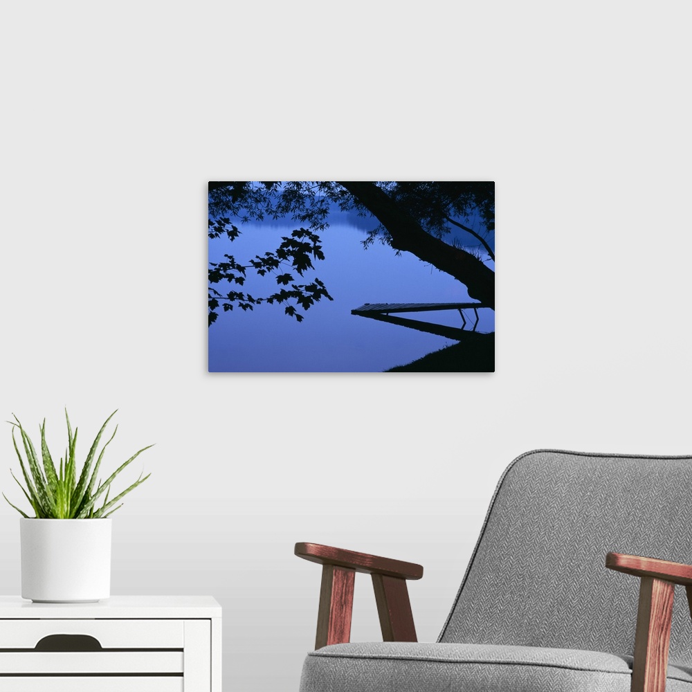 A modern room featuring Lake And Trees At Dusk