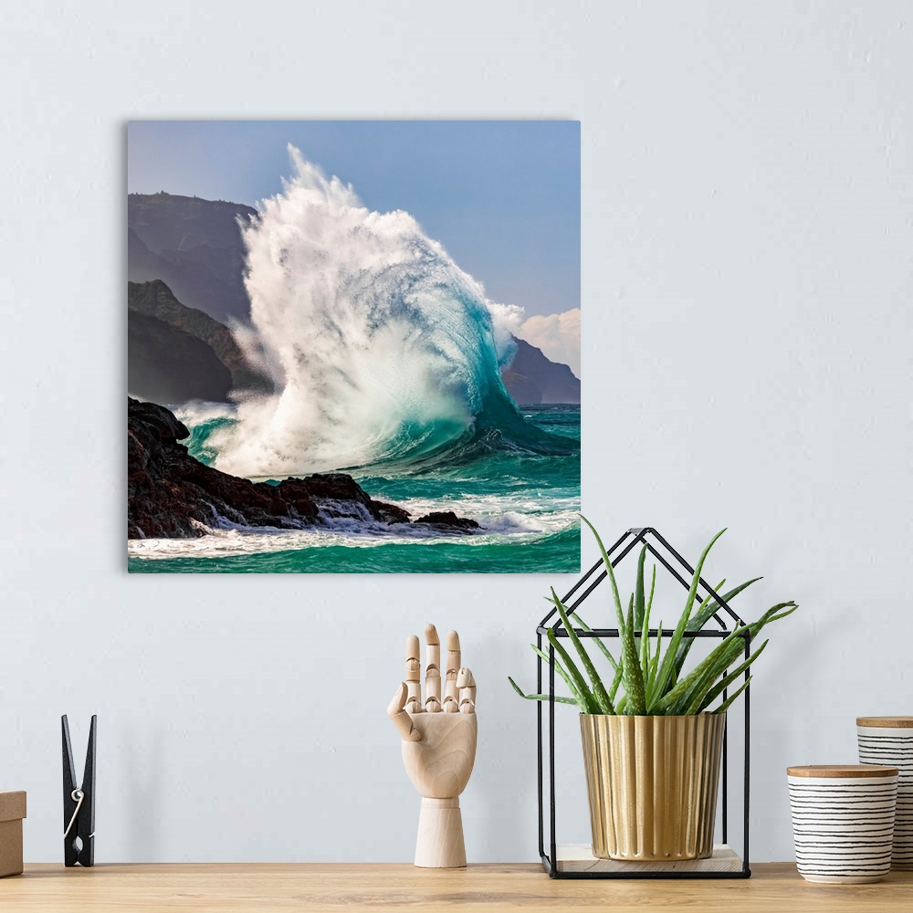 A bohemian room featuring Large ocean wave crashes into rock along the Na Pali coast, Kauai, Hawaii, united states of America.