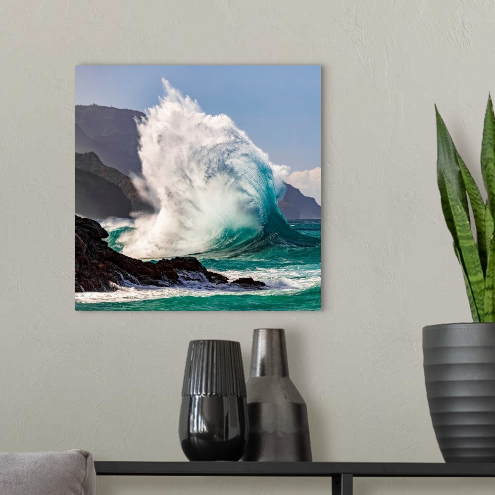 A modern room featuring Large ocean wave crashes into rock along the Na Pali coast, Kauai, Hawaii, united states of America.