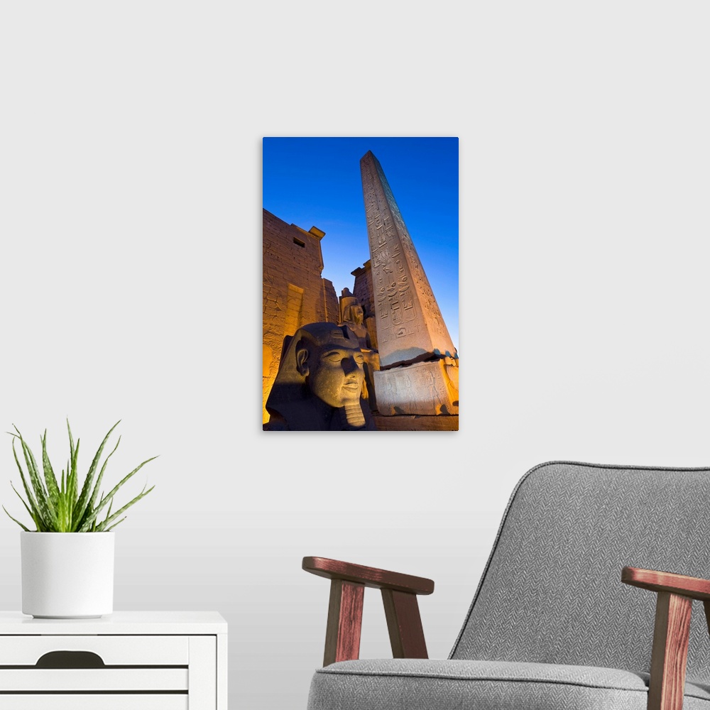 A modern room featuring Large Pharaoh's Head Statue And Obelisk