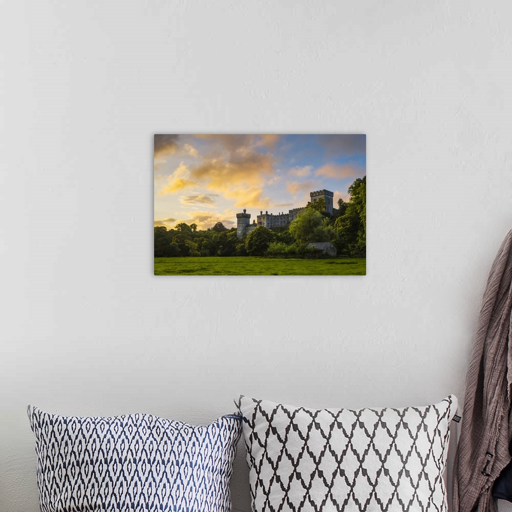 A bohemian room featuring Lismore Castle at sunrise with an epic dramatic sky; Lismore, County Waterford, Ireland.