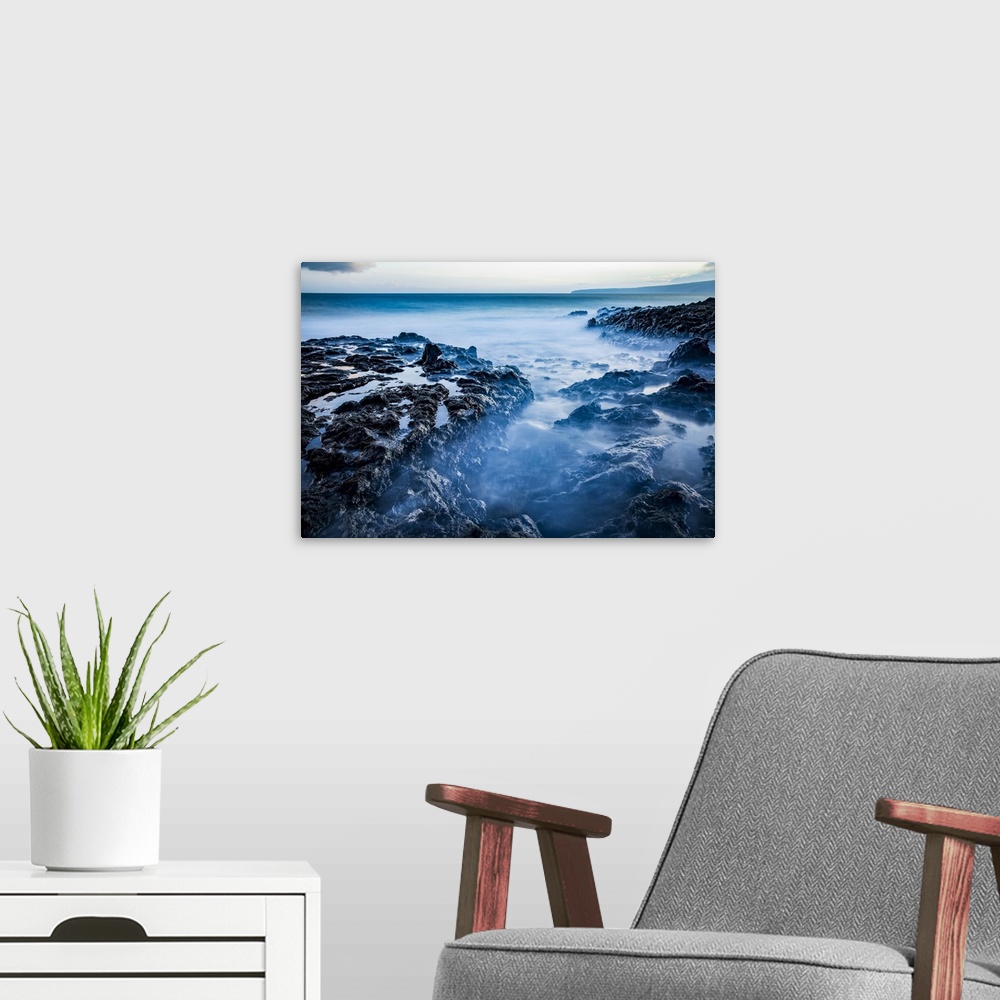 A modern room featuring Long exposure of tide pools along the coastline and a view of the Pacific Ocean; Makawao, Maui, H...