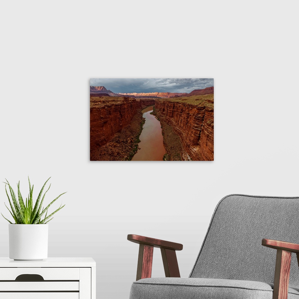 A modern room featuring Looking on Lees Ferry and the canyon walls on the Colorado River, the beginning of the Grand Cany...