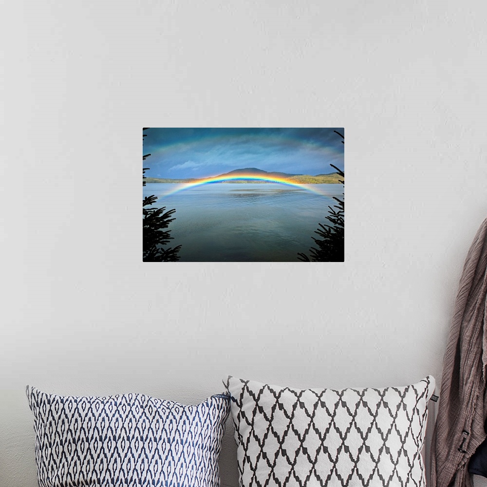 A bohemian room featuring Large landscape photograph of a rainbow over the rippling  waters of Clover Passage, in Ketchikan...