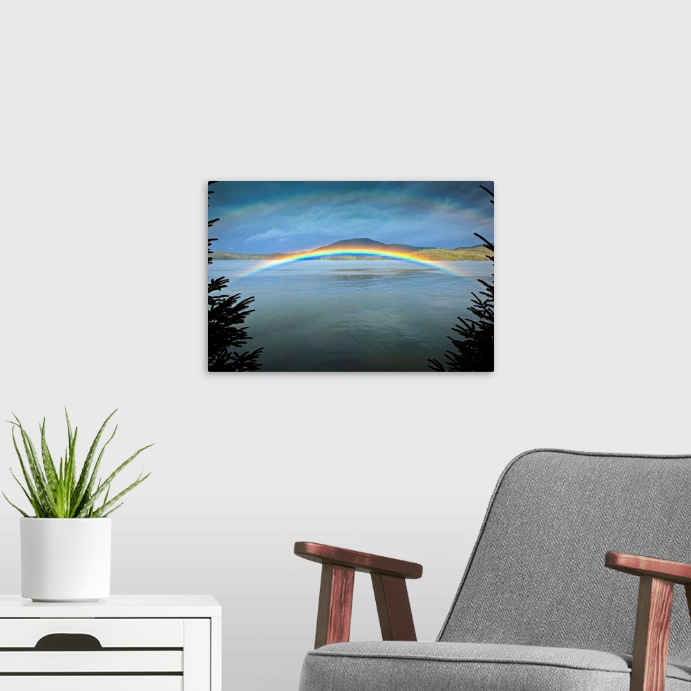 A modern room featuring Large landscape photograph of a rainbow over the rippling  waters of Clover Passage, in Ketchikan...