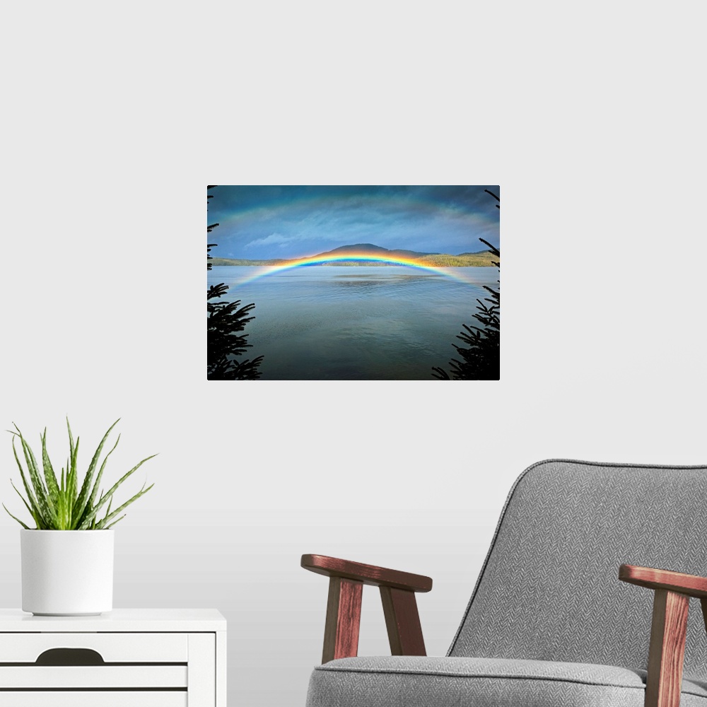 A modern room featuring Large landscape photograph of a rainbow over the rippling  waters of Clover Passage, in Ketchikan...