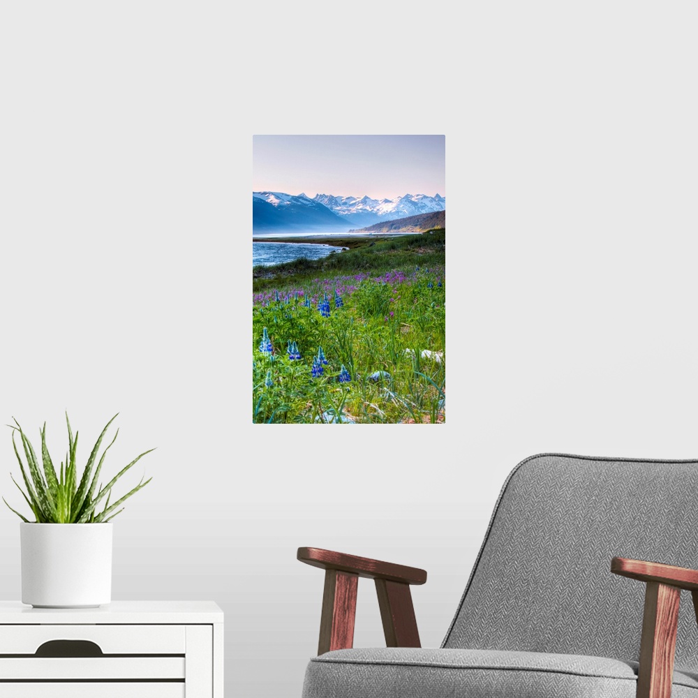 A modern room featuring This beautiful photograph is taken in Alaska with a view of snow capped mountains in the backgrou...