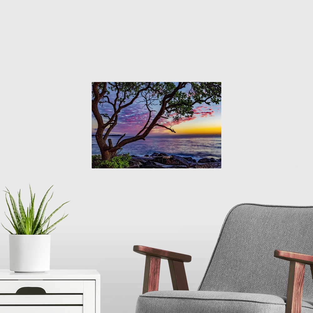 A modern room featuring Lydgate Beach at sunrise; Kapaa, Kauai, Hawaii, United States of America