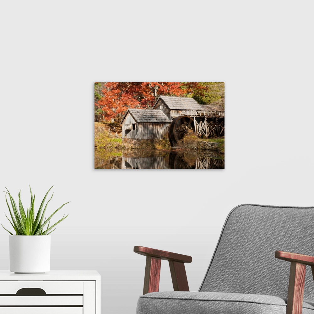 A modern room featuring Mabry Mill and pond in autumn.