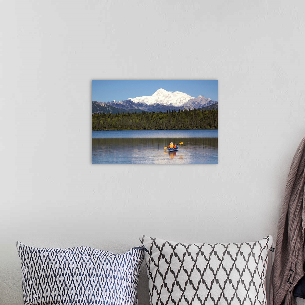 A bohemian room featuring A man paddles a Klepper kayak on Byers Lake, Denali State Park, Alaska. Mt. McKinley is in the ba...