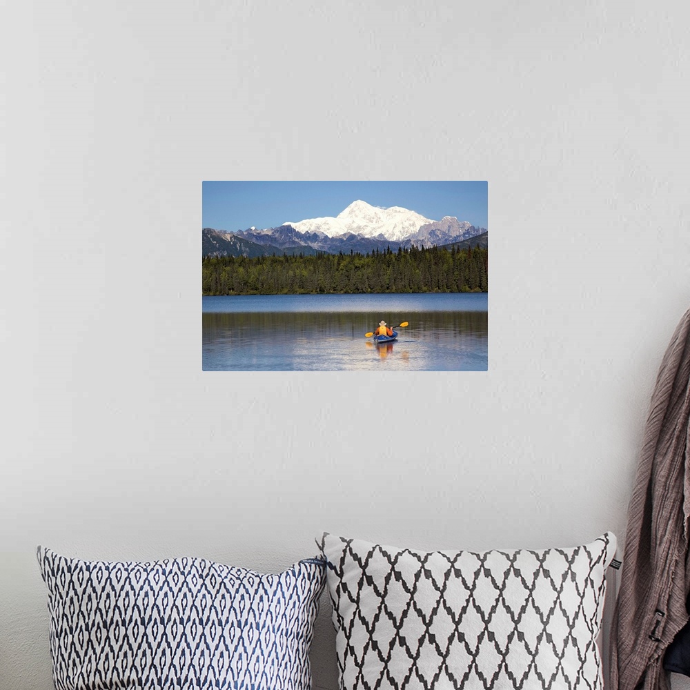 A bohemian room featuring A man paddles a Klepper kayak on Byers Lake, Denali State Park, Alaska. Mt. McKinley is in the ba...