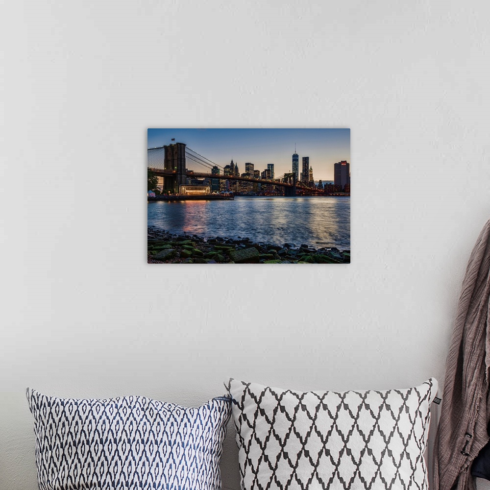A bohemian room featuring Manhattan skyline at twilight with Brooklyn Bridge, Brooklyn Bridge Park, Brooklyn, New York City...