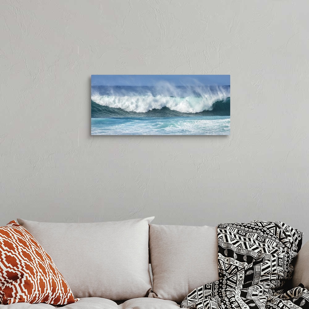 A bohemian room featuring Mist rising off crashing blue waves at the shore; Kihei, Maui, Hawaii, United States of America.