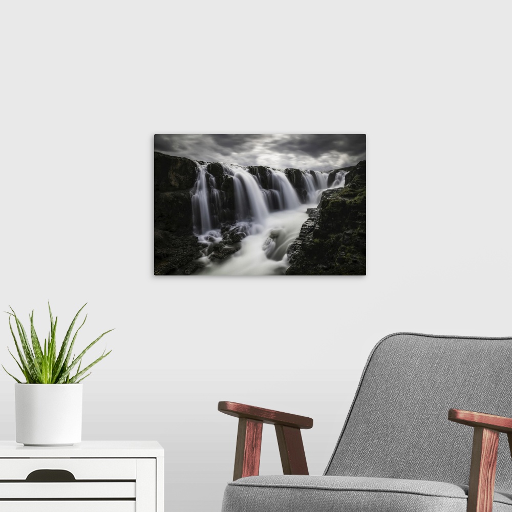 A modern room featuring Moody image of waterfalls in the central area of Iceland in a long exposure, Iceland.