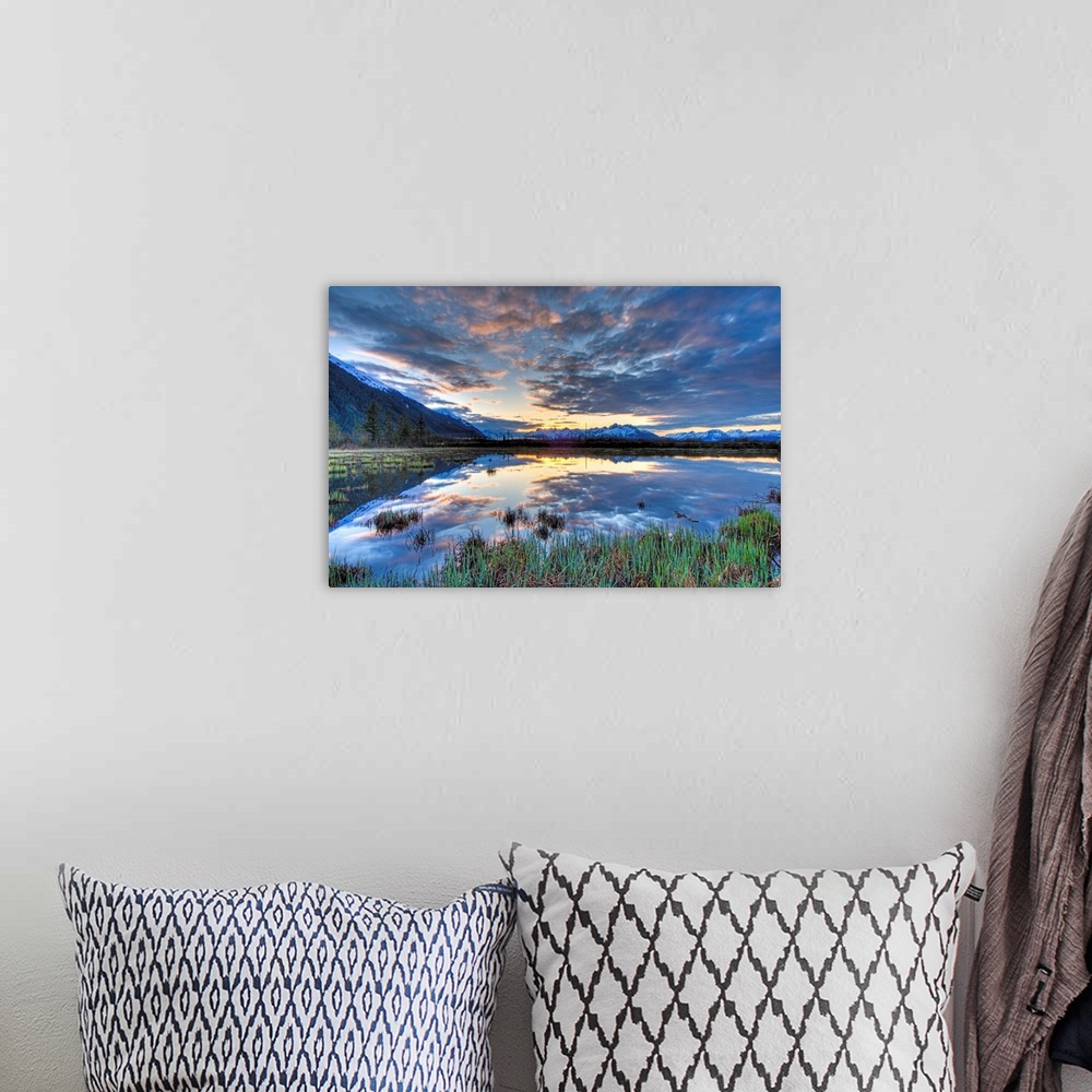 A bohemian room featuring Morning sky reflecting on a pond near the Copper River Highway outside of Cordova.  Four image HD...