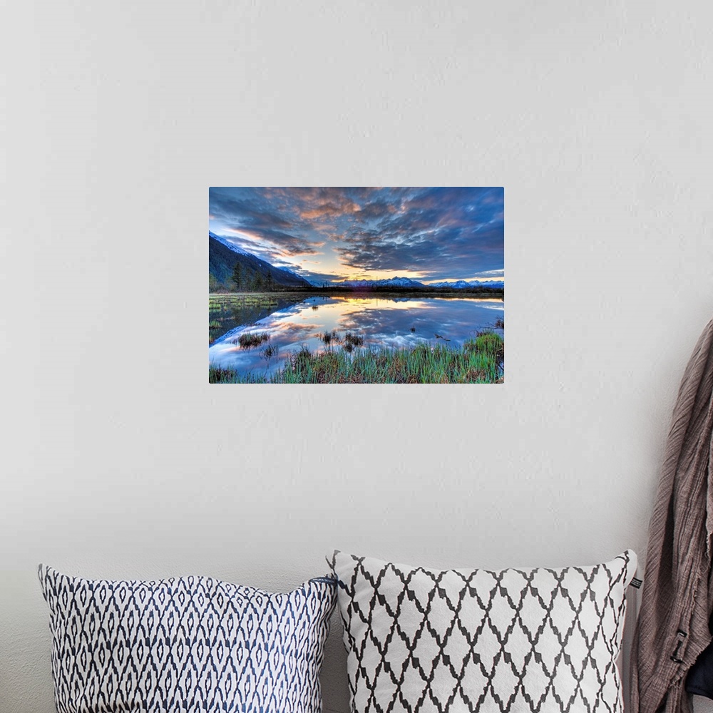 A bohemian room featuring Morning sky reflecting on a pond near the Copper River Highway outside of Cordova.  Four image HD...