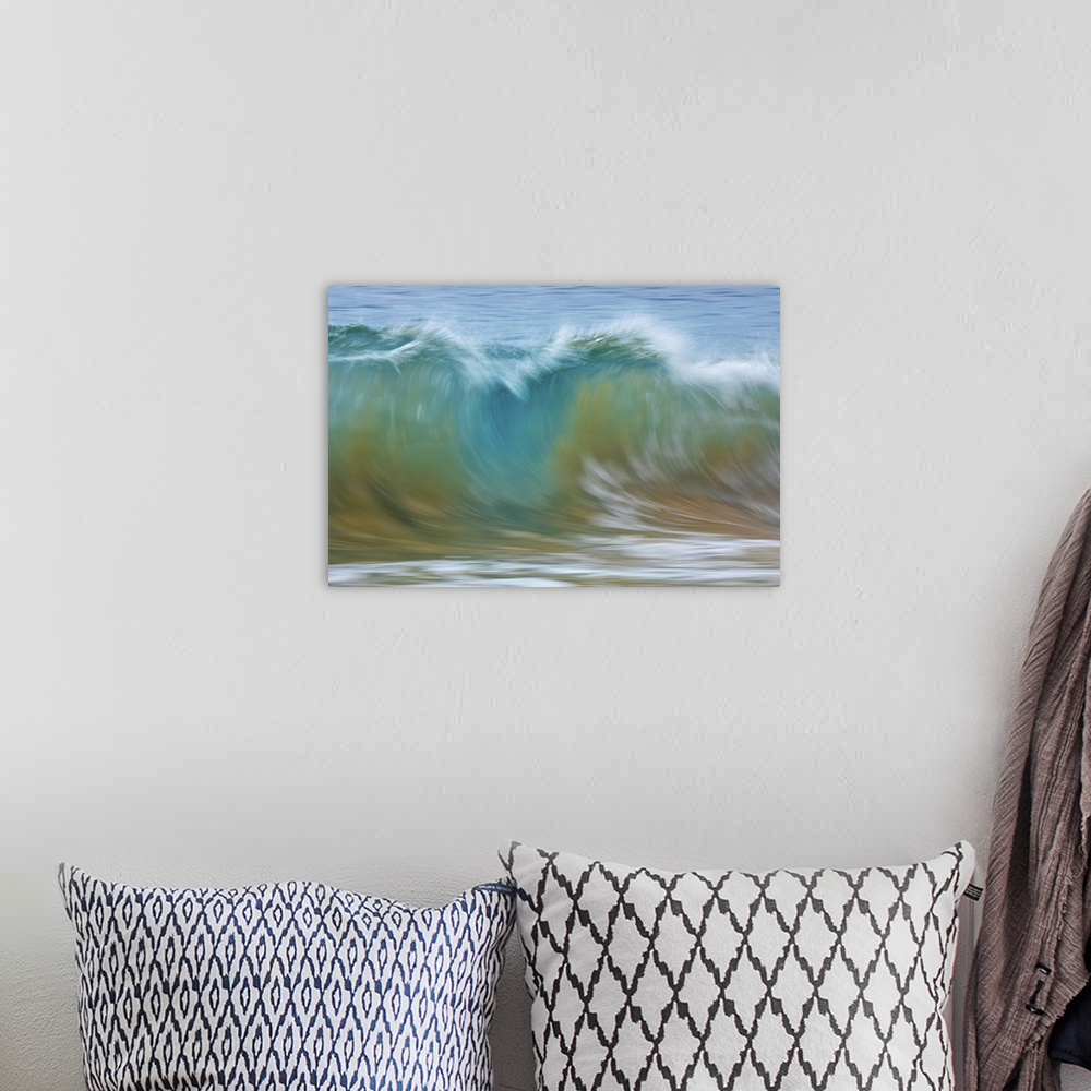 A bohemian room featuring Motion blur of blue rolling waves carrying golden sand at the shore; Kihei, Maui, Hawaii, United ...