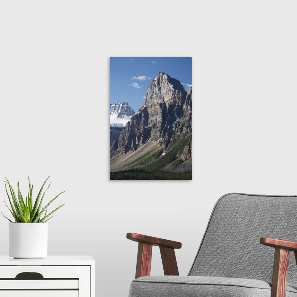 A modern room featuring Mountain Peaks With Cliff Face And Blue Sky; Alberta, Canada