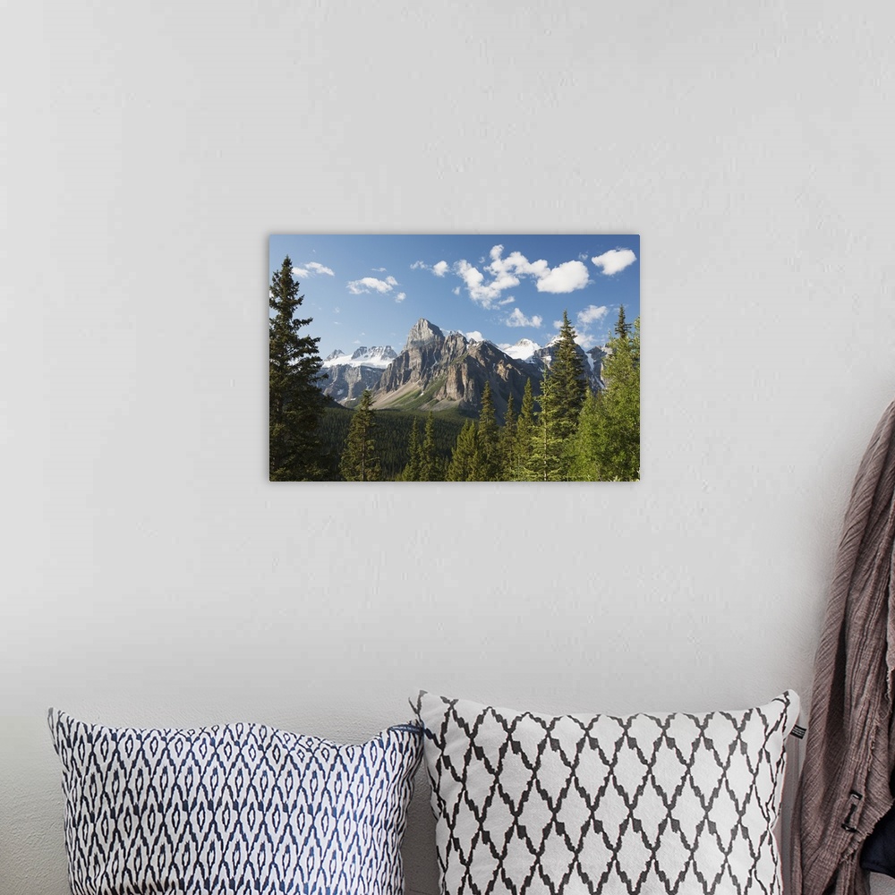 A bohemian room featuring Mountain Vista With Cliff Face And Blue Sky And Clouds; Alberta, Canada