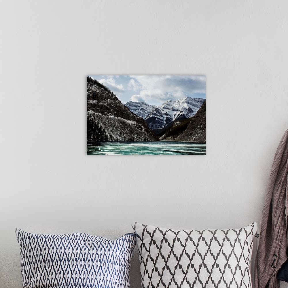 A bohemian room featuring Mountains and frozen lake in winter, Bow Valley Wildland. Alberta, Canada.