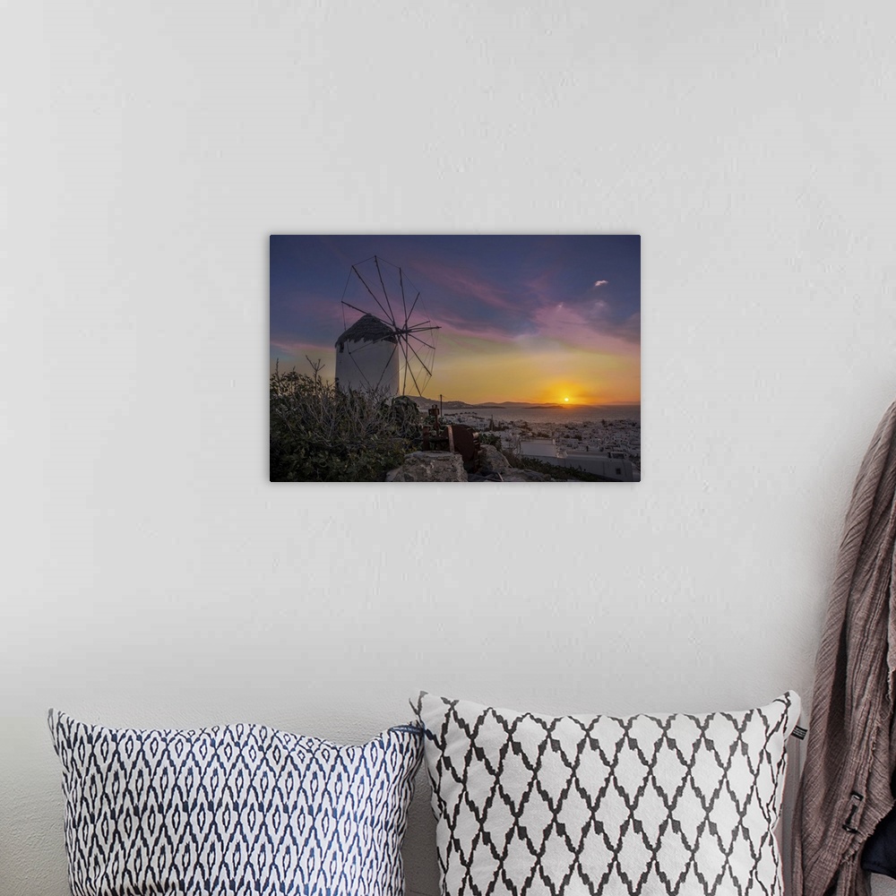 A bohemian room featuring Mykonos windmill at sunset.