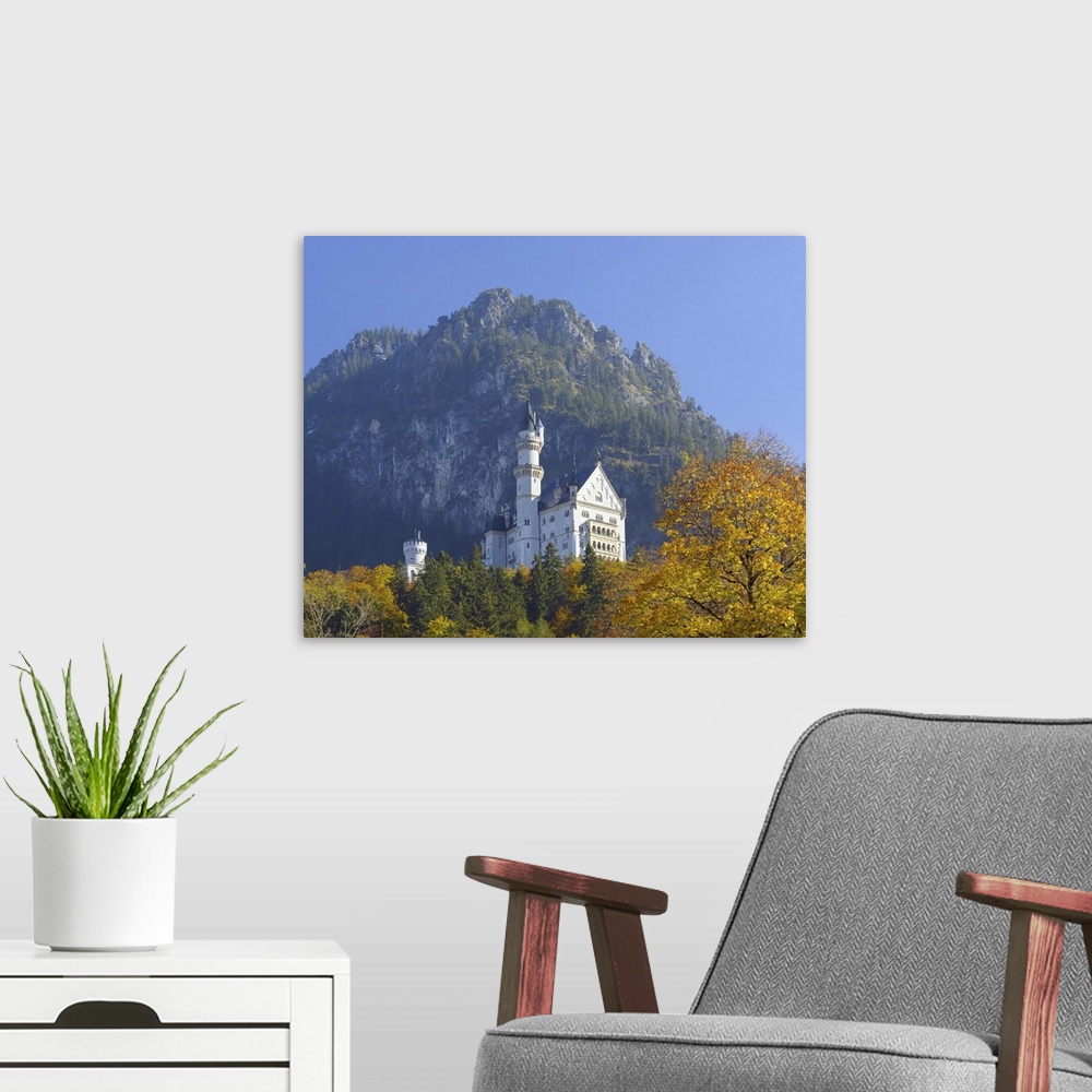 A modern room featuring Neuschwanstein Castle above the village of Hohenschwangau in autumn, Bavaria, Germany