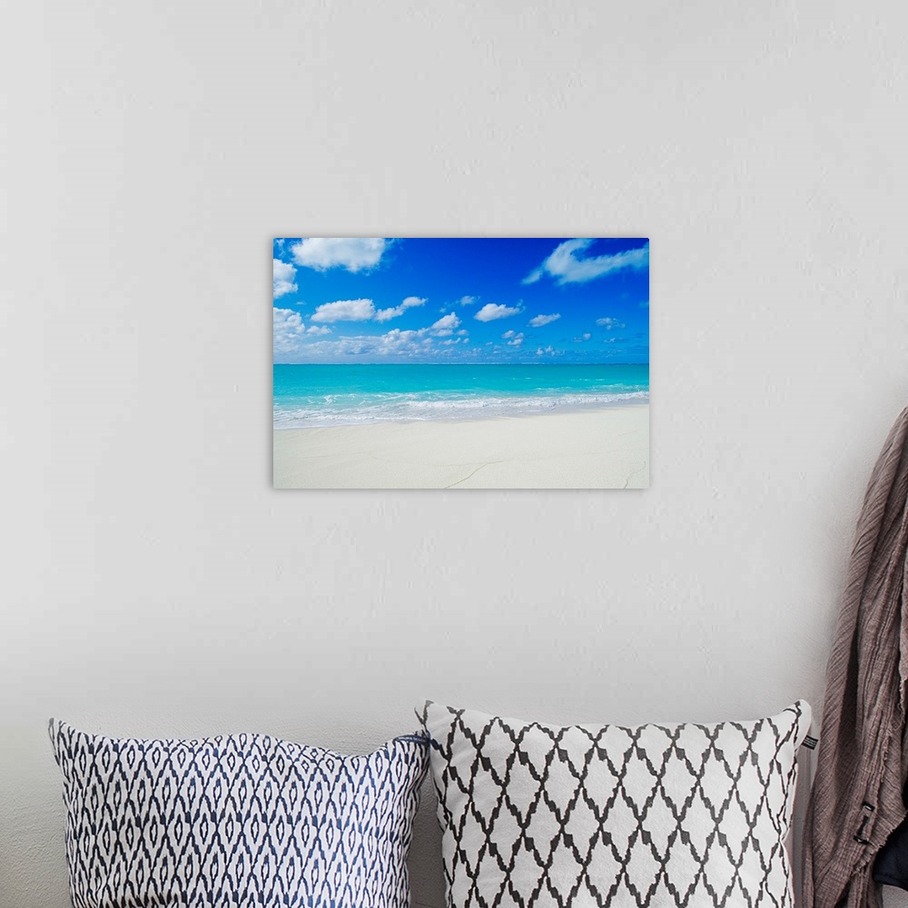 A bohemian room featuring Photograph of white sandy beach and crystal clear blue waters on a calm, clear day in Hawaii.