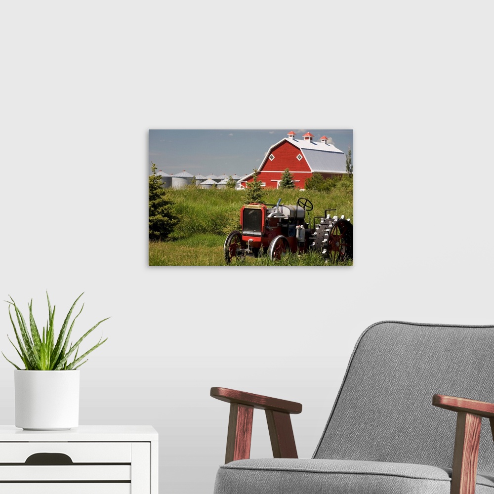 A modern room featuring Old Red Tractor In A Field With A Red Barn In The Background, Alberta, Canada