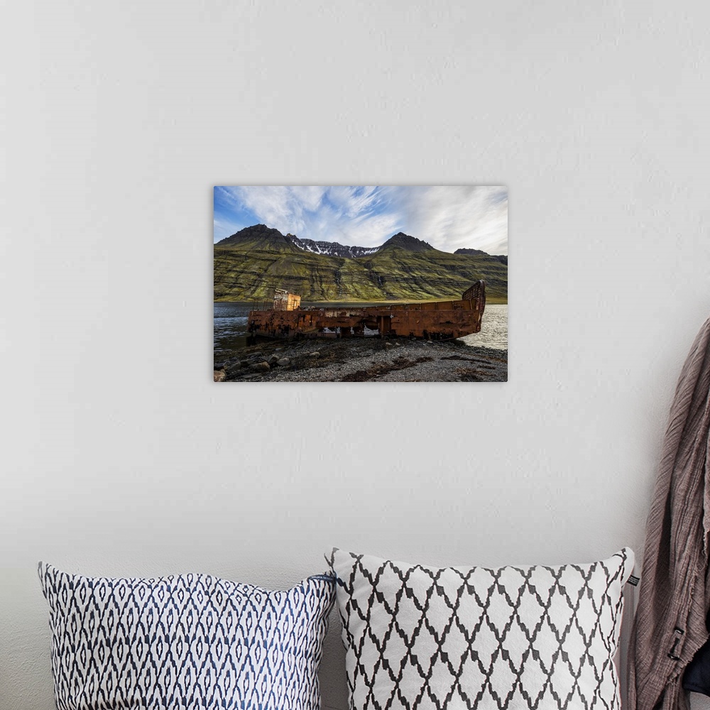 A bohemian room featuring Old Shipwreck Along The Water In Mjoifjordur, East Iceland, Iceland