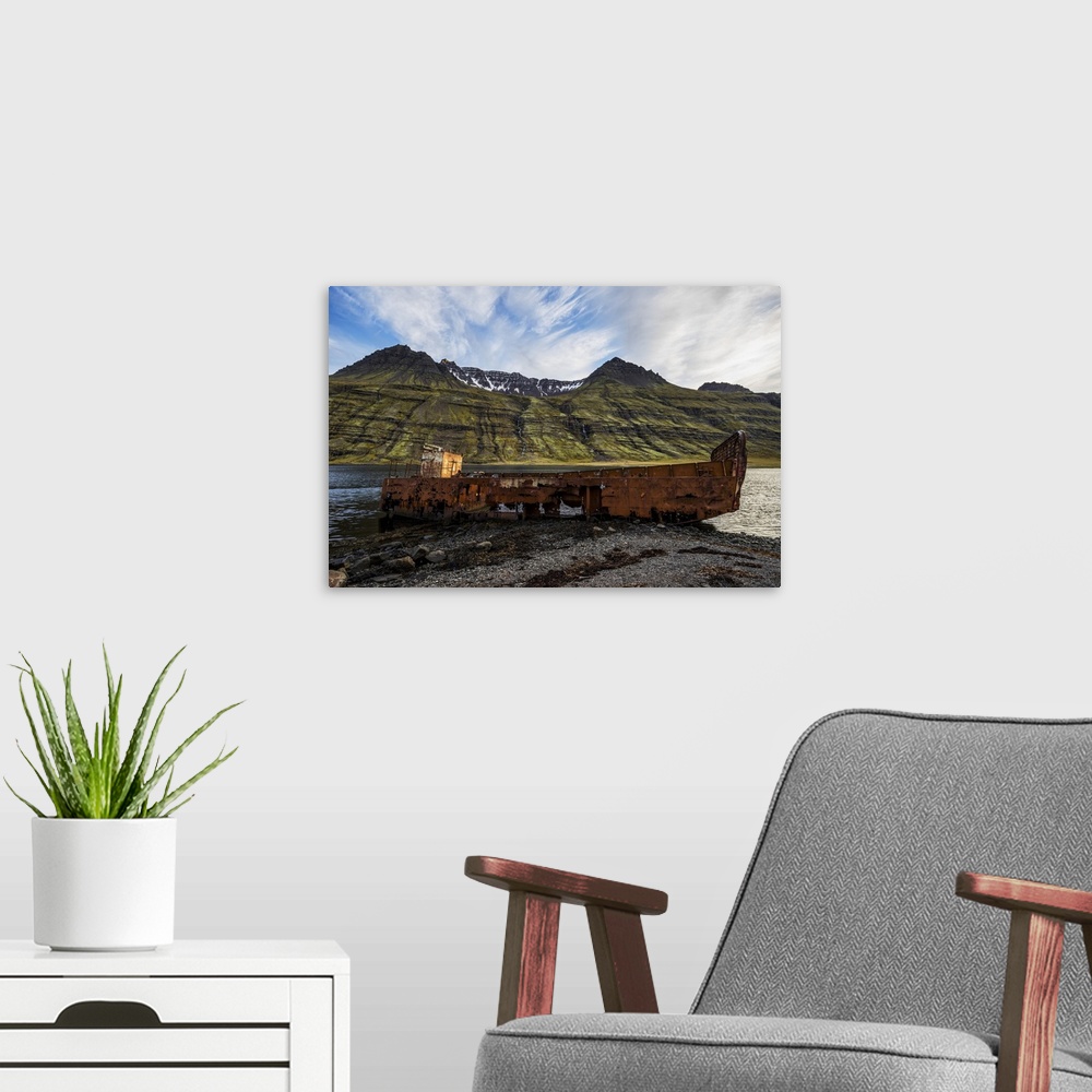 A modern room featuring Old Shipwreck Along The Water In Mjoifjordur, East Iceland, Iceland