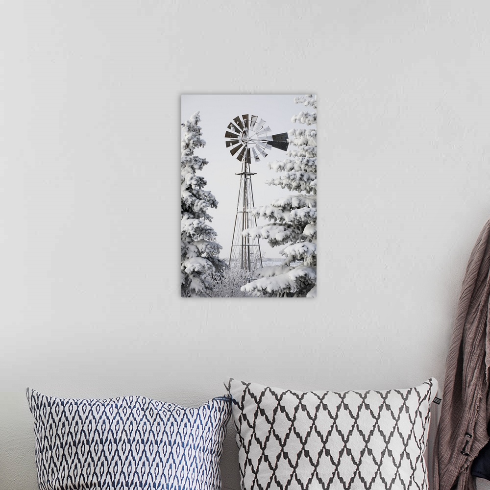 A bohemian room featuring Old Windmill And Trees Covered With Snow And Frost; Calgary, Alberta, Canada