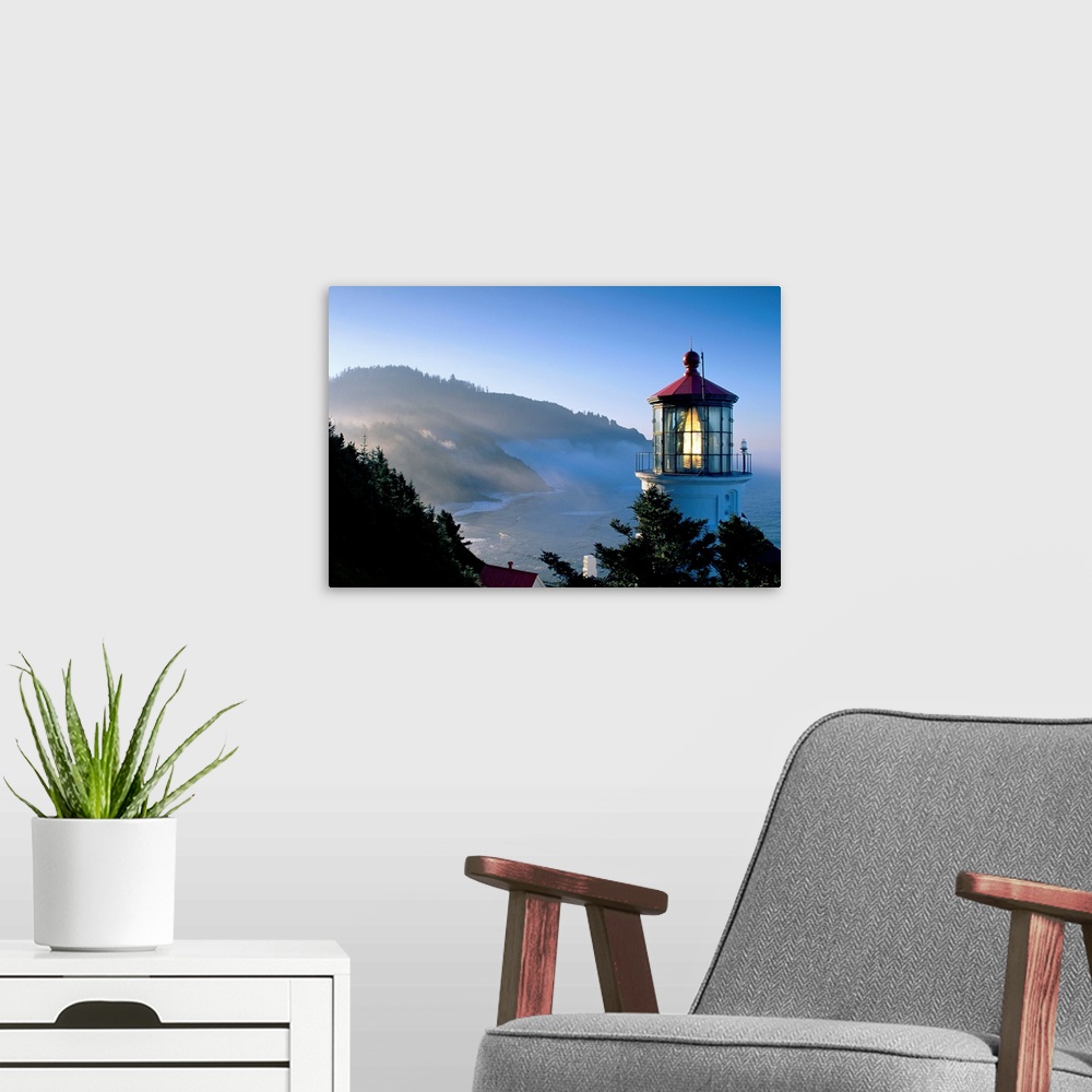 A modern room featuring Landscape, close up photograph of the top of Heceta Head Lighthouse, overlooking the coastline as...