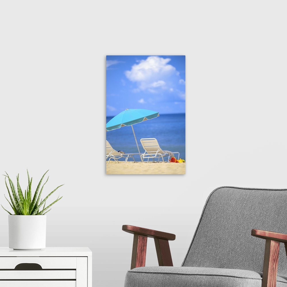 A modern room featuring Pair Of Beach Chairs And An Umbrella On White Sand Beach With Blue Skies And Water