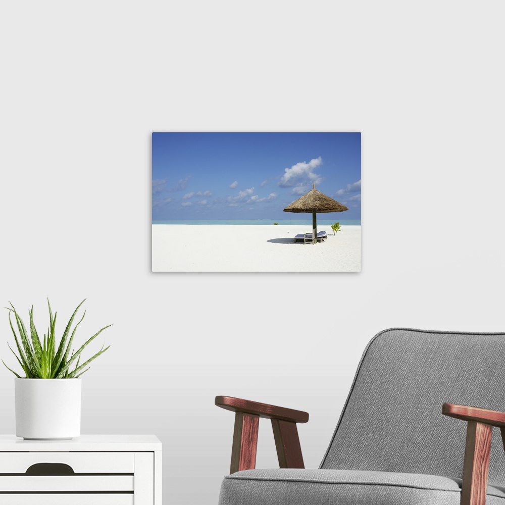 A modern room featuring Palm Hut on beach, Cocoa Island, Maldives