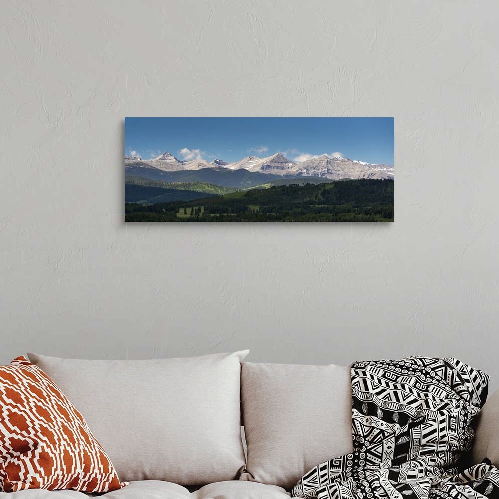 A bohemian room featuring Panorama of foothills and the Canadian Rockies mountain range with blue sky and clouds, West of H...