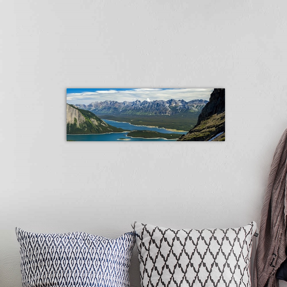 A bohemian room featuring Panorama on top of mountain ridge looking down on colourful alpine lake and mountain range in the...