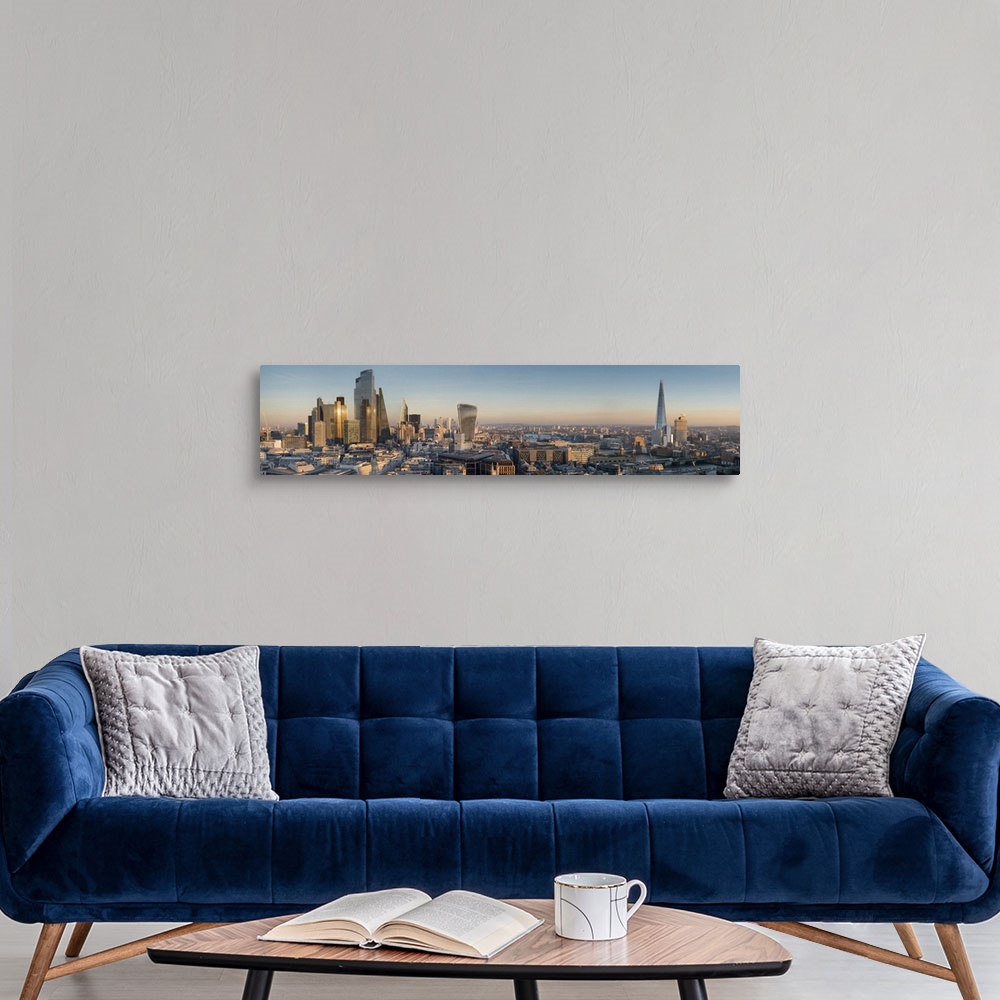 A modern room featuring Panoramic cityscape and skyline of London with The Shard, 20 Fenchurch and various other skyscrap...