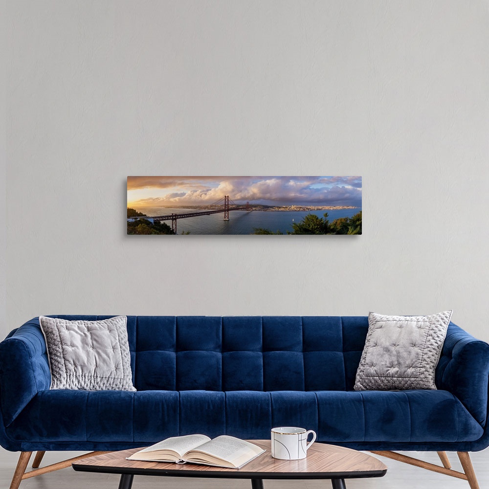 A modern room featuring Panoramic view of 25 de Abril Bridge at sunset and cityscape of Lisbon, Lisbon, Portugal