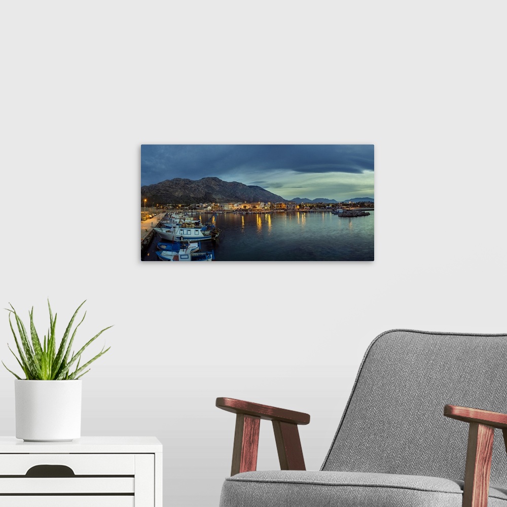 A modern room featuring Panoramic view of the harbour at twilight.