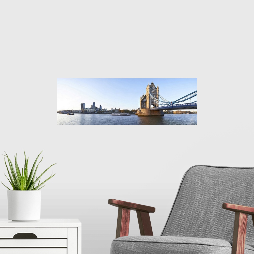 A modern room featuring Panoramic view of Tower bridge from Canary Wharf to the city from south bank of the river Thames.