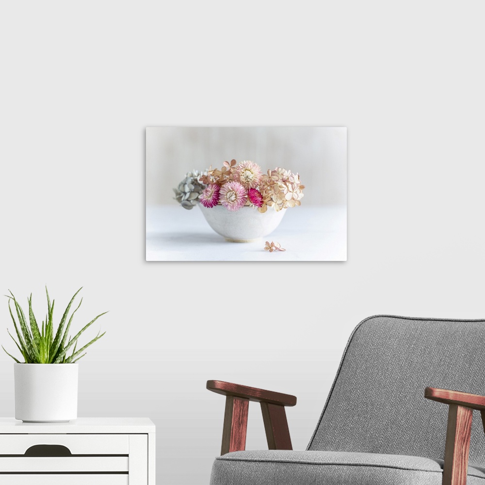 A modern room featuring Pastel dried flowers in a bowl.